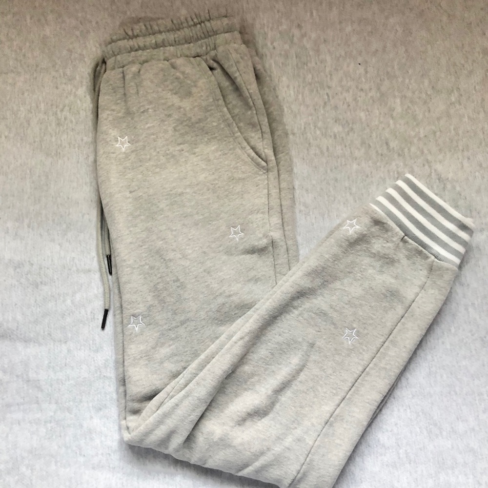 Grafitti sweatpants with white embroidered starts